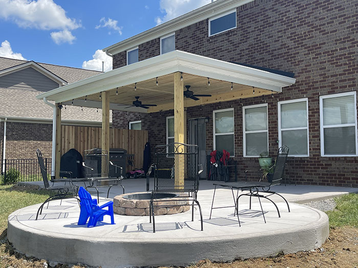 Completed roof extension with patio and fire pit view 1